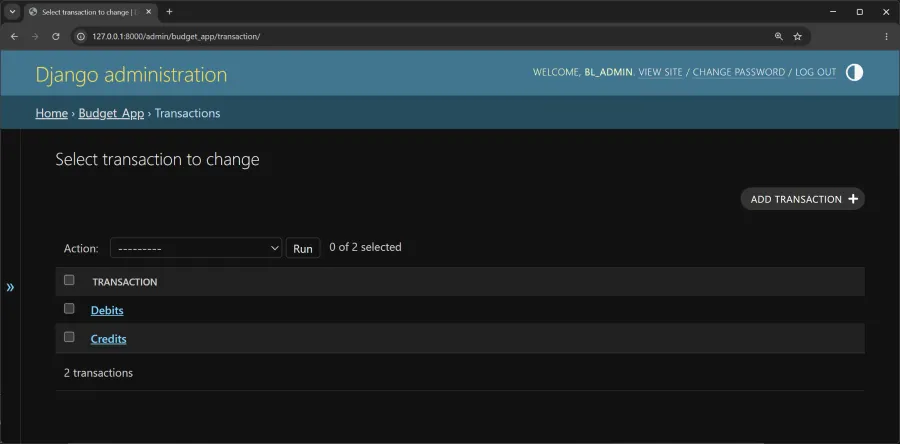 Django administration page in a desktop web browser showing the Budget_App Transactions list view after setup is complete. The page heading reads Select transaction to change. A table lists two transaction entries named Debits and Credits, and a button on the right says Add transaction. The top navigation and header text include Django administration, Home, Budget_App, Transactions, and Welcome, BL_ADMIN, View site, Change password, Log out. The browser address bar shows 127.0.0.1:8000/admin/budget_app/transaction/. The wider environment is a clean blue and gray admin interface with no people present, and the tone is orderly and task focused.